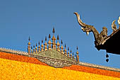 Luang Prabang, Laos - Wat Nong Sikhunmuang with its elaborate 'dok so faa' with a central umbrella and seven parasols on each side. 